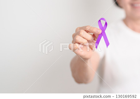 Elderly with Purple Ribbon for Violence, Pancreatic, Esophageal, Testicular cancer, Alzheimer, Epilepsy, Lupus, Crohn, Thyroid,  Sarcoidosis and Fibromyalgia. Awareness month and World cancer day 130169592
