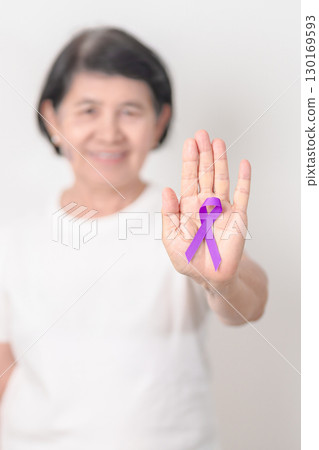 Elderly with Purple Ribbon for Violence, Pancreatic, Esophageal, Testicular cancer, Alzheimer, Epilepsy, Lupus, Crohn, Thyroid,  Sarcoidosis and Fibromyalgia. Awareness month and World cancer day 130169593