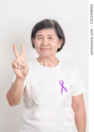 Elderly with Purple Ribbon for Violence, Pancreatic, Esophageal, Testicular cancer, Alzheimer, Epilepsy, Lupus, Crohn, Thyroid,  Sarcoidosis and Fibromyalgia. Awareness month and World cancer day 130169600