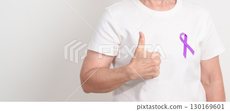Elderly with Purple Ribbon for Violence, Pancreatic, Esophageal, Testicular cancer, Alzheimer, Epilepsy, Lupus, Crohn, Thyroid,  Sarcoidosis and Fibromyalgia. Awareness month and World cancer day 130169601
