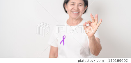 Elderly with Purple Ribbon for Violence, Pancreatic, Esophageal, Testicular cancer, Alzheimer, Epilepsy, Lupus, Crohn, Thyroid,  Sarcoidosis and Fibromyalgia. Awareness month and World cancer day 130169602