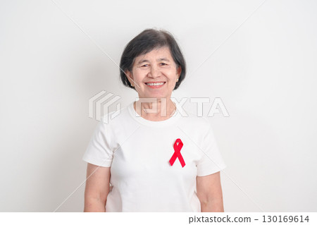 Elderly with Red Ribbon for December World Aids Day, MADD, October Red ribbon week, February Heart month, Marfan Syndrome, May Stroke awareness, March world TB Tuberculosis day and April Dare day Elderly with Red Ribbon for December World Aids Day, MADD, October Red ribbon week, February Heart month, Marfan Syndrome, May Stroke awareness, March world TB Tuberculosis day and April Dare day 130169614