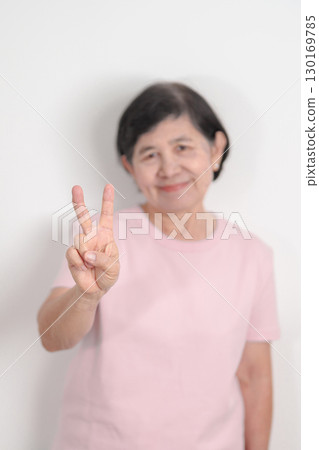 Elderly woman with pink Shirt for Pink October Breast Cancer Awareness month, May Women Health, women rights, Empowerment, March International Women day, February Valentine, May International Mother 130169785