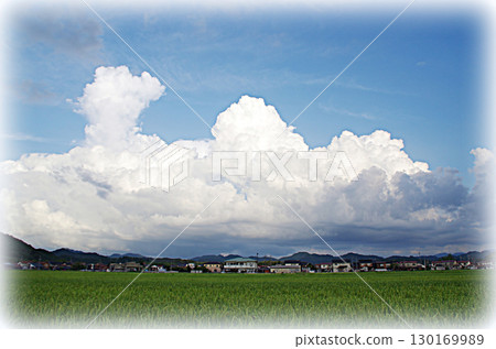 A huge cumulonimbus cloud developing above a distant mountain range seen from the countryside (illustration style) A huge cumulonimbus cloud developing above a distant mountain range seen from the countryside (illustration style) 130169989