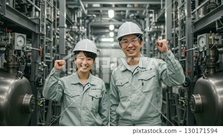 Men and women in the manufacturing industry working in a factory 130171594