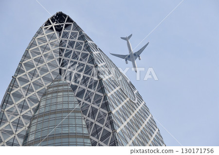 A passenger plane flying over Shinjuku's skyscrapers on a clear day A passenger plane flying over Shinjuku's skyscrapers on a clear day 130171756