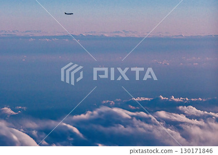 A flying jet seen from an airplane 130171846