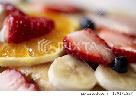 Assorted fruits including strawberries, bananas, oranges, and blueberries Assorted fruits including strawberries, bananas, oranges, and blueberries 130171857