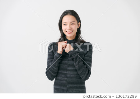 A woman wearing a black knit A woman wearing a black knit 130172289