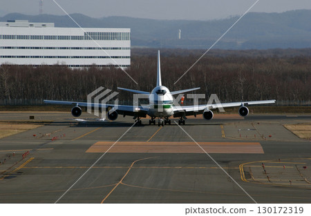Plane landing and heading to the terminal 130172319