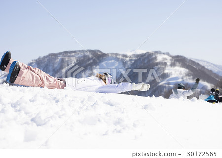 Cute woman enjoying the snow 130172565
