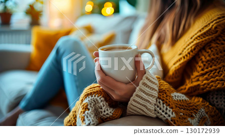 a relax woman hold white cup of coffee for mock up . a relax woman hold white cup of coffee for mock up . 130172939