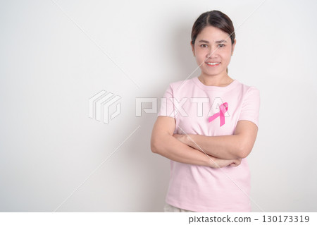 Pink October Breast Cancer Awareness month, woman with pink Ribbon for concepts of support people life and illness. National cancer survivors month, Women Health day and February World cancer day 130173319