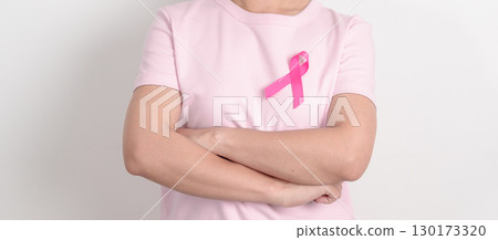 Pink October Breast Cancer Awareness month, woman with pink Ribbon for concepts of support people life and illness. National cancer survivors month, Women Health day and February World cancer day 130173320