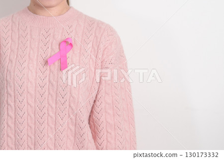 Pink October Breast Cancer Awareness month, woman with pink Ribbon for concepts of support people life and illness. National cancer survivors month, Women Health day and February World cancer day Pink October Breast Cancer Awareness month, woman with pink Ribbon for concepts of support people life and illness. National cancer survivors month, Women Health day and February World cancer day 130173332