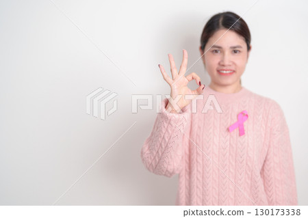 Pink October Breast Cancer Awareness month, woman with pink Ribbon for concepts of support people life and illness. National cancer survivors month, Women Health day and February World cancer day 130173338