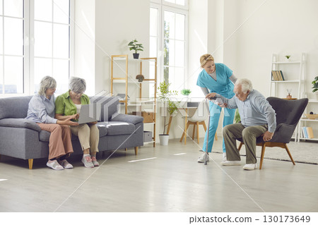 Retirement home room with skilled nurse and senior residents, nursing care and service for old  130173649
