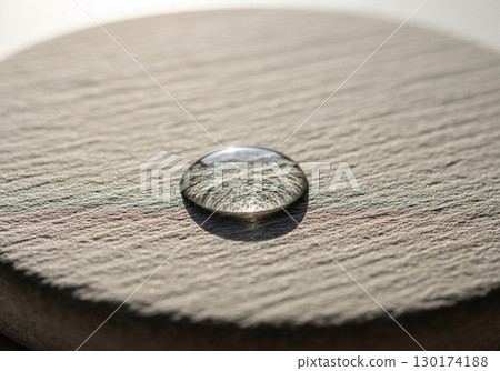 Closeup of a water drop on a stone 130174188