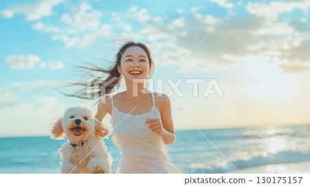 Happy Woman Running on the Beach with her Dog 130175157