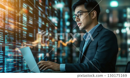 Focused Programmer Working Late 130175169