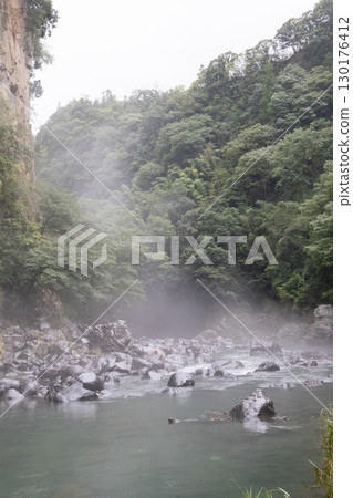 A hidden waterfall shrouded in mist A hidden waterfall shrouded in mist 130176412