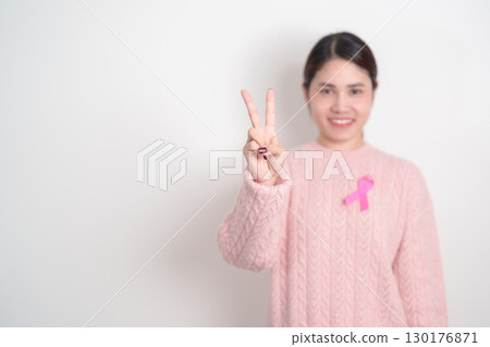 Pink October Breast Cancer Awareness month, woman with pink Ribbon for concepts of support people life and illness. National cancer survivors month, Women Health day and February World cancer day 130176871