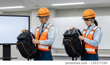 Workers engaged in safety and disaster prevention training 130177164