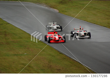 Formula car splashing water 130177286