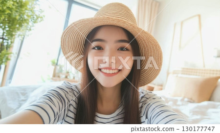 Happy Young Woman Taking a Selfie Happy Young Woman Taking a Selfie 130177747