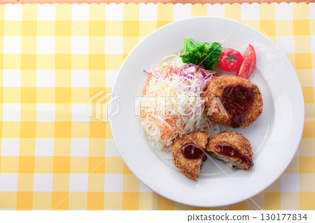 Steaming freshly fried croquette set meal with shredded cabbage, rice, miso soup and pickles for a Japanese lunch Steaming freshly fried croquette set meal with shredded cabbage, rice, miso soup and pickles for a Japanese lunch 130177834