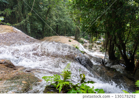 Saluopa waterfall in the tropical forest of Tentena, Sulawesi, Indonesia 130178292