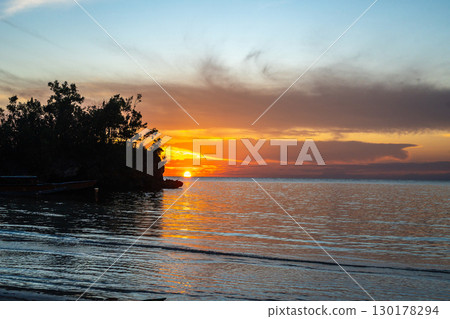 Sunset on Lia beach, Waleakodi Island, Togian archipelago, Sulawesi, Indonesia Sunset on Lia beach, Waleakodi Island, Togian archipelago, Sulawesi, Indonesia 130178294