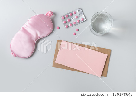 Pink sleeping mask, prescription and vitamins capsules. Concept of daily routine. 130178643