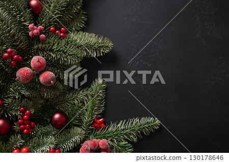 Christmas frame with red gift and decorations on black. Xmas greeting card. Christmas frame with red gift and decorations on black. Xmas greeting card. 130178646