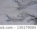 Aerial view of gray abstract mud patterns and cracks on acid mine drainage surface 130179084