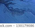Aerial view of gray abstract mud patterns and cracks on acid mine drainage surface 130179086