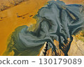 Patterns of acid mine drainage in decanting lake, nature pollution, aerial view 130179089