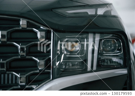 Front close up view of modern black car 130179593