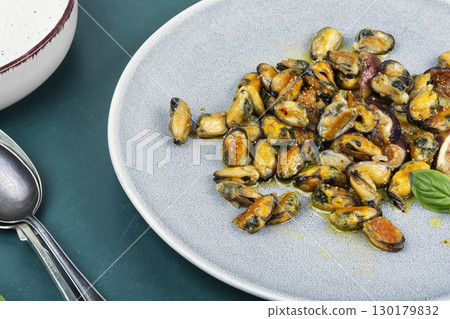 Mussels cooked with figs. 130179832