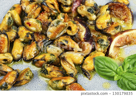 Steamed mussels and figs. 130179835