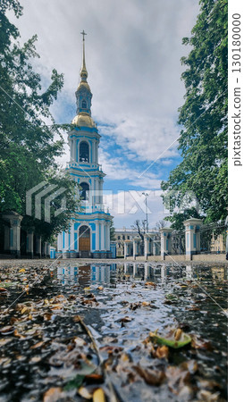 Panoramic view of St. Nicholas Naval Cathedral with high bell tower. Beautiful reflection in water. Nikolo-Bogoyavlenskiy Morskoy Sobor built in 1762 in Saint Petersburg, Russia 130180000