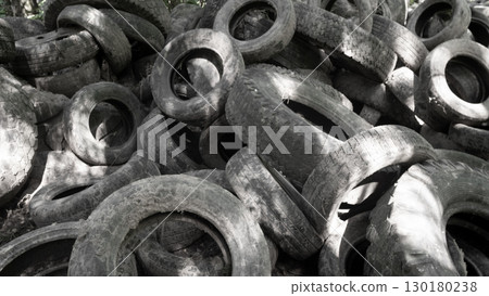 A visually striking closeup of worn tires artistically creating an abstract texture in various shades of gray A visually striking closeup of worn tires artistically creating an abstract texture in various shades of gray 130180238