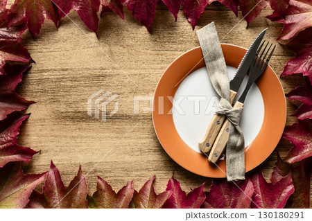 Thanksgiving Concept with Autumn Leaves and Plate 130180291