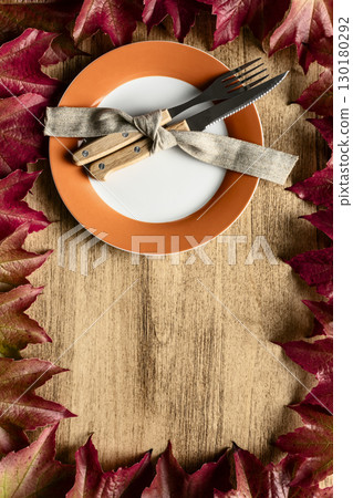 Thanksgiving Concept with Autumn Leaves and Plate Thanksgiving Concept with Autumn Leaves and Plate 130180292