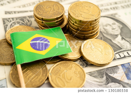 Brazil flag on coin and banknote money, finance trading investment business currency. Brazil flag on coin and banknote money, finance trading investment business currency. 130180338