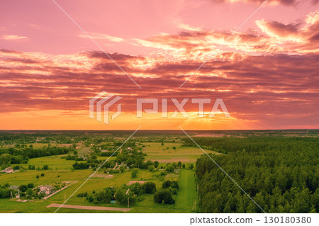 Rural landscape at sunset. Countryside in the evening. Aerial view 130180380