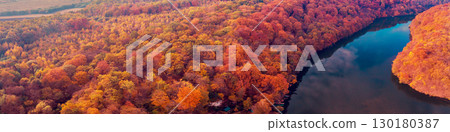 Panoramic view from above of a beautiful lake in autumn during sunset Panoramic view from above of a beautiful lake in autumn during sunset 130180387