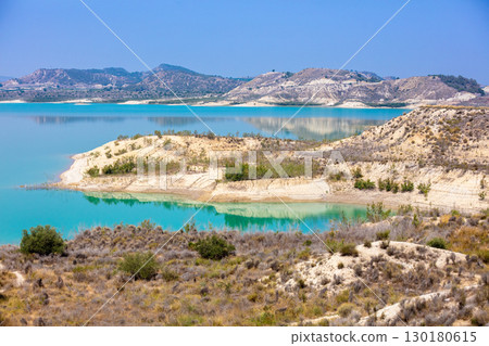 Mountain lake on a sunny day. Embalse de la Pedrera Reservoir, Alicante, Spain 130180615