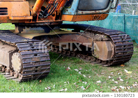Closeup View of Continuous or Caterpillar Tracks on an Excavating Machine at a Construction Site 130180723