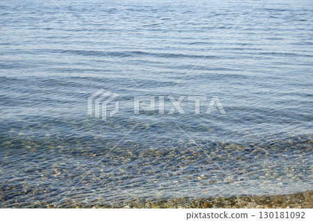 Slight waves on the sea. Ocean water ripple background. Seawater rippled surface. 130181092